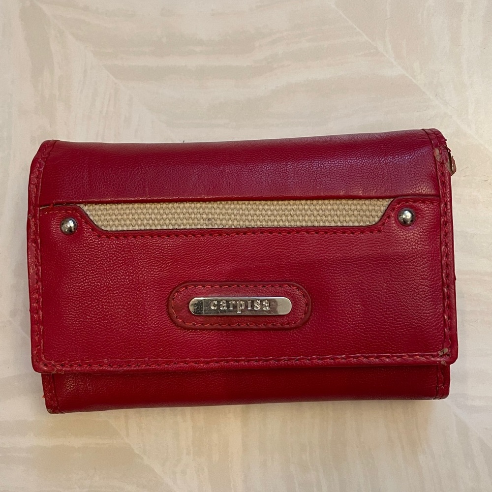 Carpisa Italy red wallet Exterior. Condition is good with some worn parts